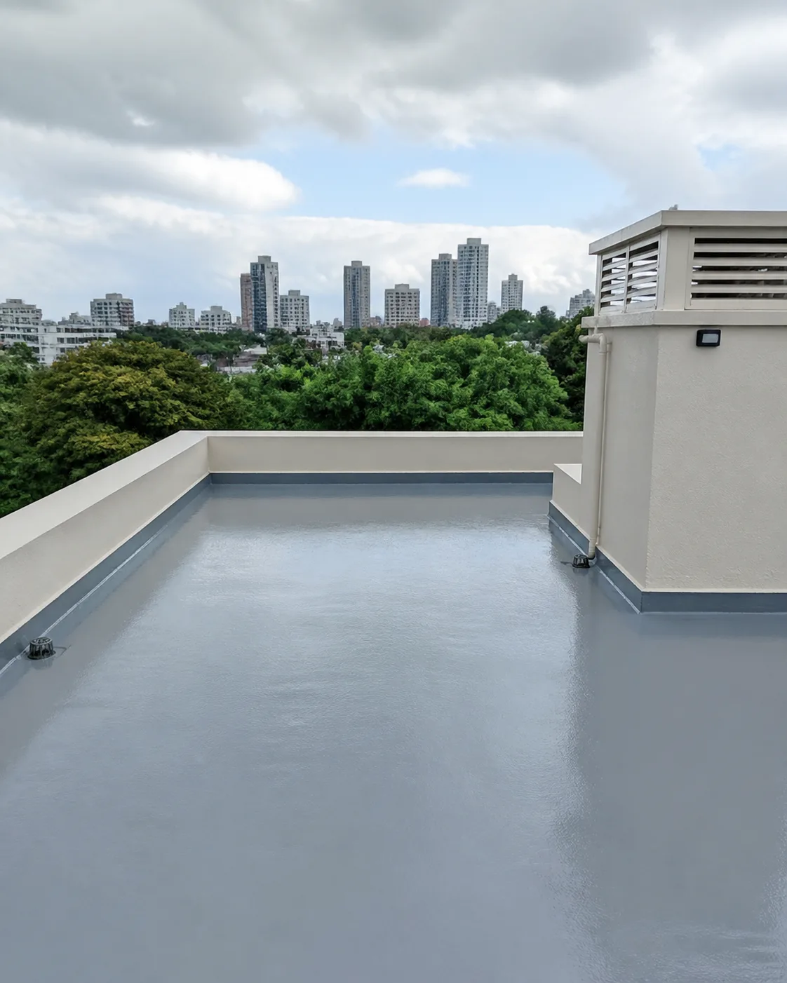 Waterproof coating being applied to an exposed surface